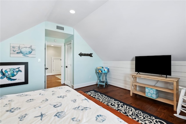 bedroom with lofted ceiling and dark wood-type flooring