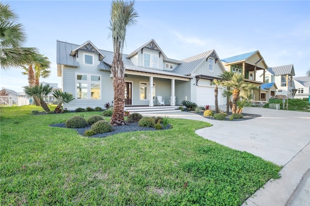 view of front facade featuring a front yard and a garage