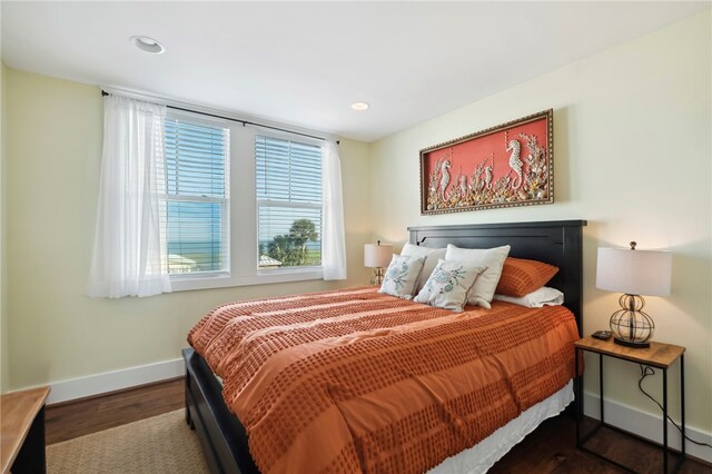 bedroom featuring dark hardwood / wood-style flooring