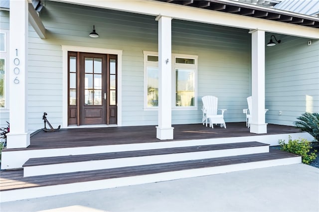 doorway to property with covered porch