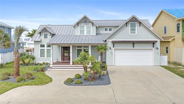 view of front of home featuring a garage and a front yard