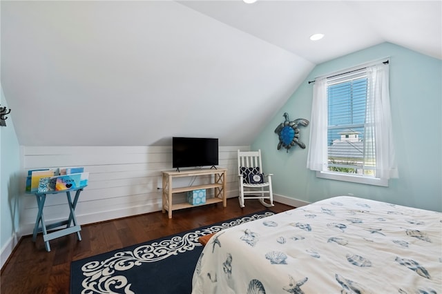 bedroom with lofted ceiling and dark hardwood / wood-style floors