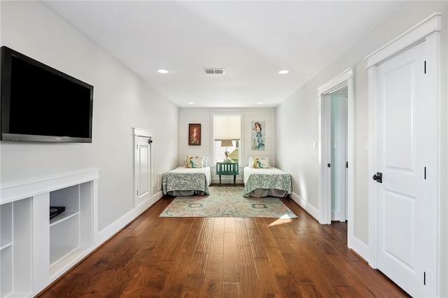 unfurnished bedroom with hardwood / wood-style floors