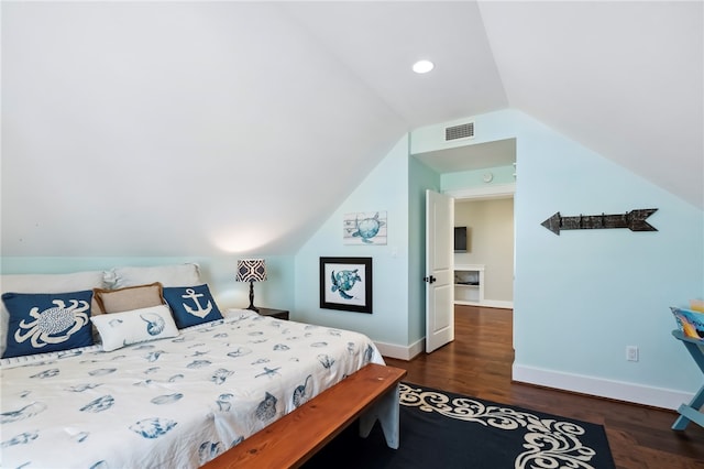 bedroom with dark wood-type flooring and vaulted ceiling