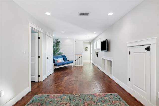 corridor with dark hardwood / wood-style floors