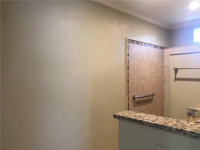 bathroom featuring tiled shower