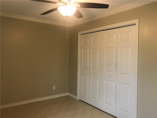 unfurnished bedroom featuring ornamental molding, ceiling fan, and a closet