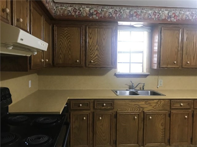 kitchen featuring black electric range oven and sink