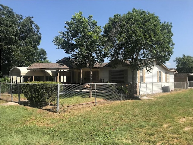 exterior space featuring cooling unit, a carport, and a yard