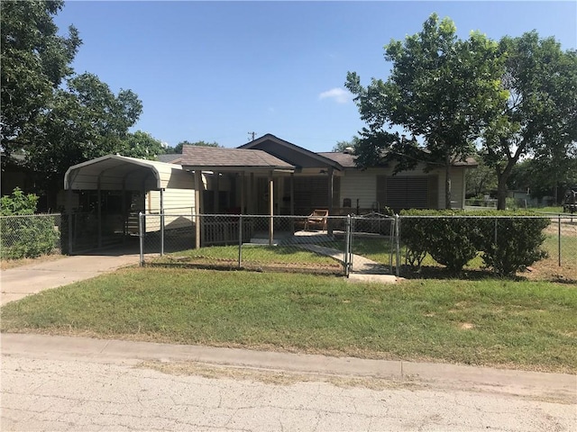 view of front facade with a carport and a front yard