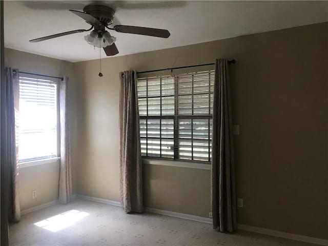 spare room with ceiling fan