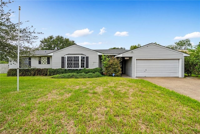 ranch-style home featuring a front lawn and a garage