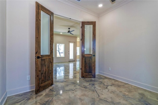 foyer featuring marble finish floor, baseboards, and ornamental molding