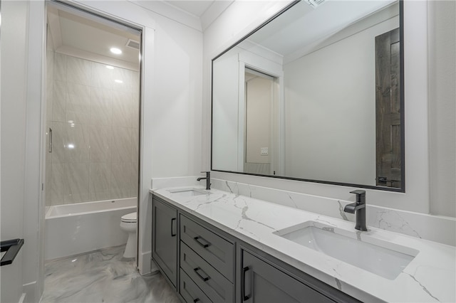 full bathroom featuring vanity, toilet, tiled shower / bath, and crown molding