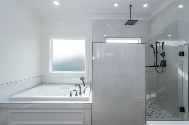 bathroom with a bath, crown molding, tiled shower, and recessed lighting