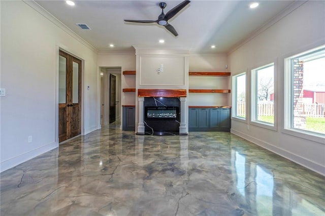 unfurnished living room featuring baseboards, visible vents, a glass covered fireplace, crown molding, and recessed lighting