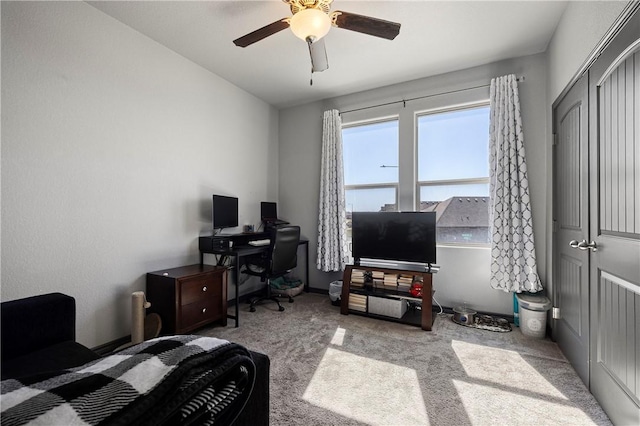 carpeted bedroom featuring a ceiling fan