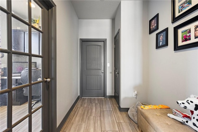 entryway featuring baseboards