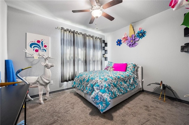 bedroom featuring baseboards, carpet, and a ceiling fan