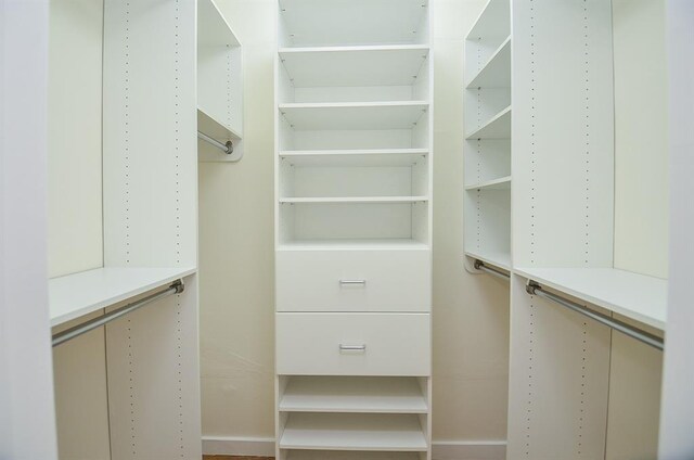 unfurnished bedroom featuring crown molding and multiple windows