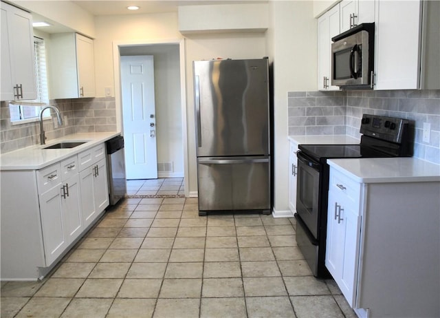 kitchen with white cabinetry, appliances with stainless steel finishes, and sink