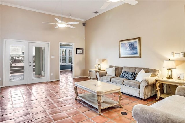 13530 Royal Fifth Ct, Corpus Christi, TX 78418 - living area with a ceiling fan, a high ceiling, ornamental molding, light tile patterned floors, and french doors