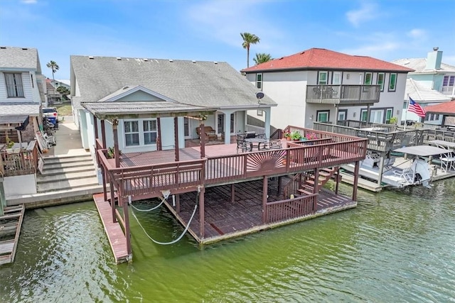 13530 Royal Fifth Ct, Corpus Christi, TX 78418 - back of house with a patio, a deck with water view, and stairway