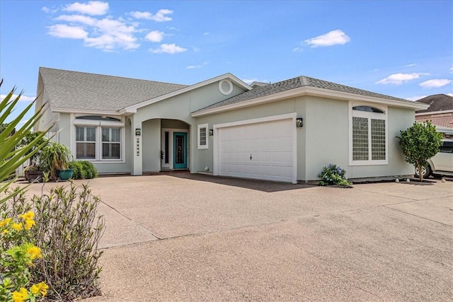 13530 Royal Fifth Ct, Corpus Christi, TX 78418 - ranch-style house with an attached garage, driveway, roof with shingles, and stucco siding