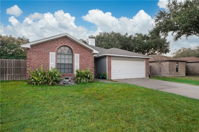 view of front facade with a front yard and a garage