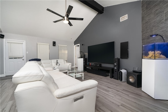 living room with beamed ceiling, light hardwood / wood-style flooring, high vaulted ceiling, and ceiling fan