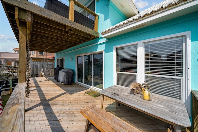 view of patio / terrace featuring a grill and a wooden deck