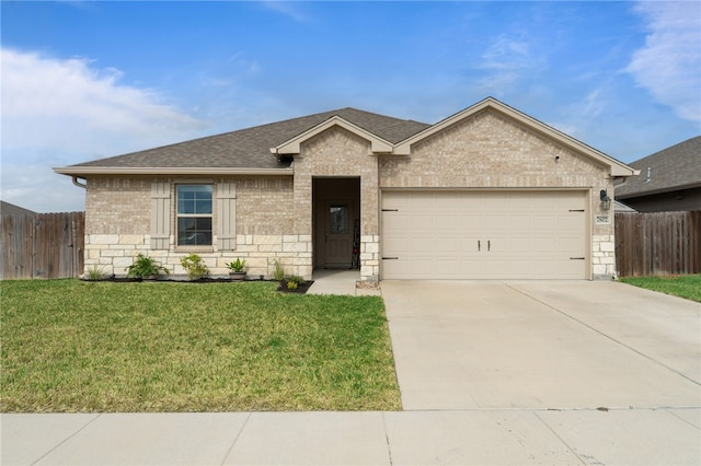 ranch-style house with a garage and a front yard