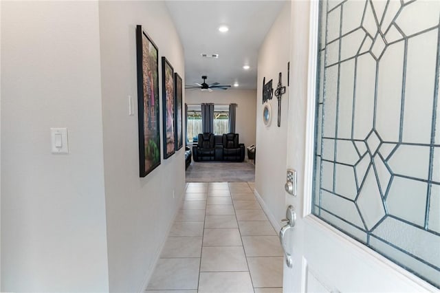 corridor featuring light tile patterned flooring