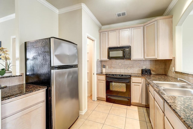 kitchen with tasteful backsplash, black appliances, sink, crown molding, and light tile patterned floors