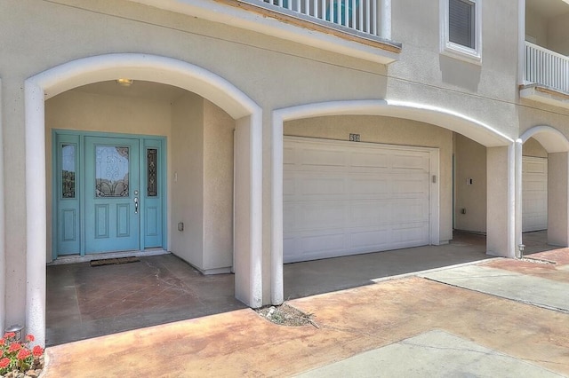 doorway to property featuring a garage