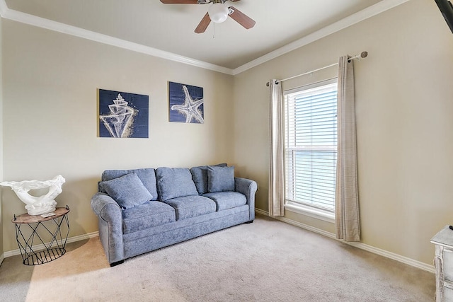 carpeted living room with ceiling fan and ornamental molding