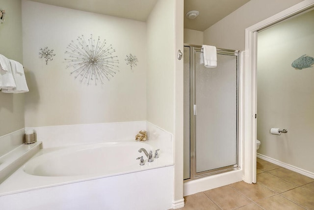 bathroom with tile patterned floors, toilet, and independent shower and bath