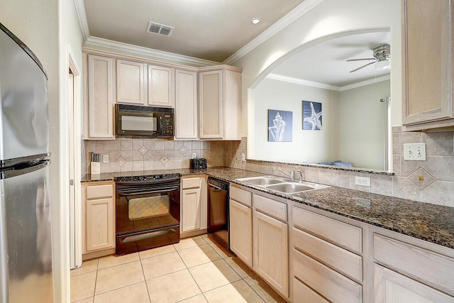 kitchen featuring black appliances, sink, ornamental molding, ceiling fan, and light tile patterned floors