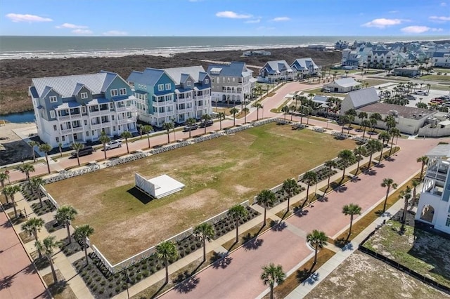 bird's eye view with a beach view and a water view