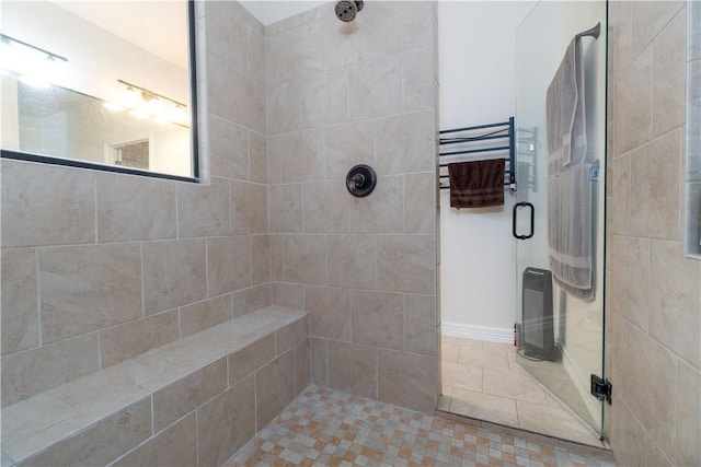 full bathroom with a stall shower and tile patterned floors