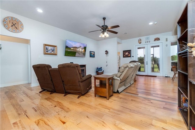 living room featuring light wood finished floors, french doors, a ceiling fan, and recessed lighting