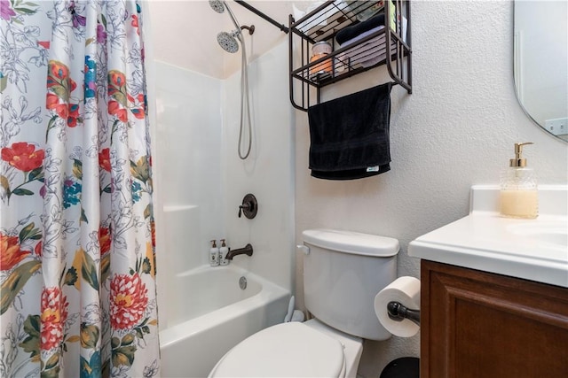 full bath with toilet, a textured wall, shower / bath combo, and vanity