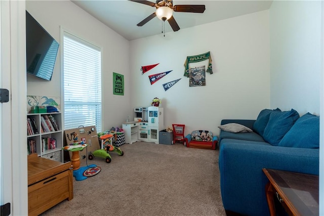 game room with ceiling fan and carpet