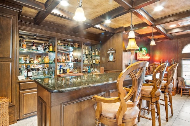 122 Bay Ct, Aransas Pass, TX 78336 - indoor wet bar featuring wood walls, beam ceiling, coffered ceiling, light tile patterned flooring, and wood ceiling