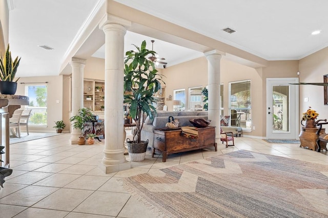 122 Bay Ct, Aransas Pass, TX 78336 - entryway with light tile patterned floors, ornate columns, ornamental molding, and baseboards