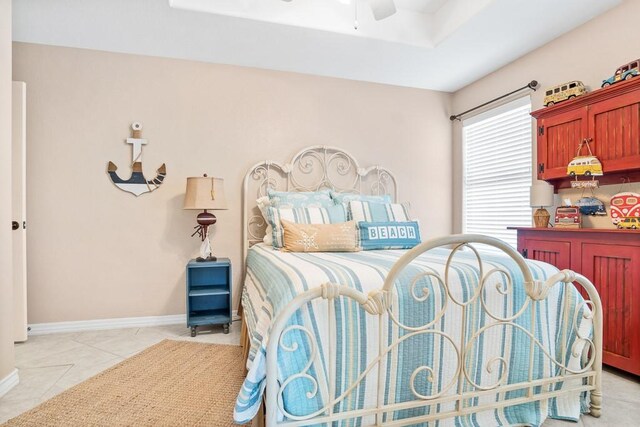 122 Bay Ct, Aransas Pass, TX 78336 - bedroom featuring light tile patterned floors, baseboards, and ceiling fan