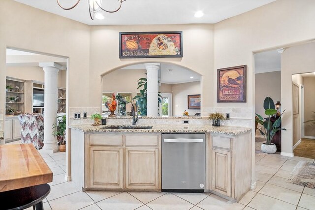 122 Bay Ct, Aransas Pass, TX 78336 - kitchen with dishwasher, decorative columns, a sink, light brown cabinetry, and a high ceiling