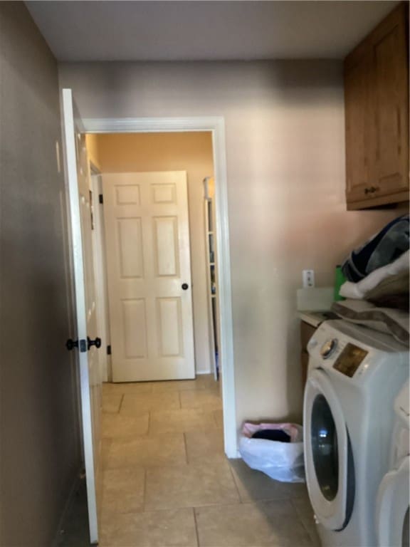 washroom with washer / dryer