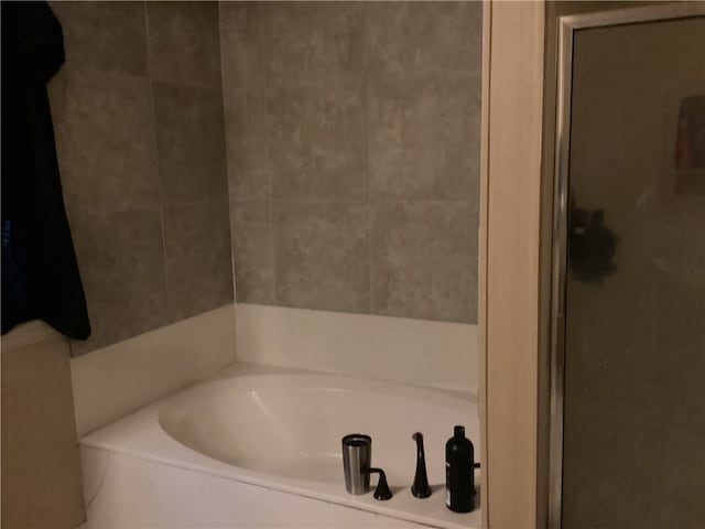 bathroom with separate shower and tub