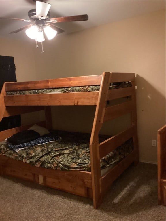 bedroom with ceiling fan and carpet floors